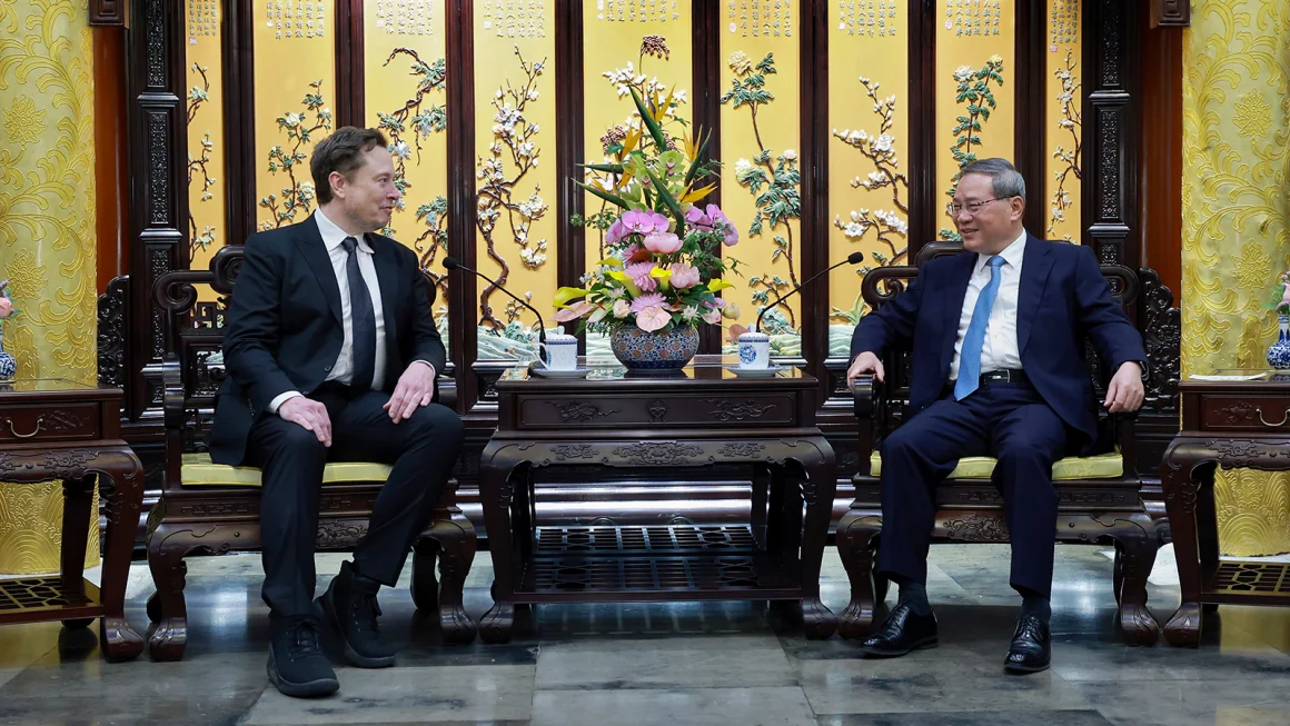 Elon Musk shaking hands with Chinese Premier Li Qiang